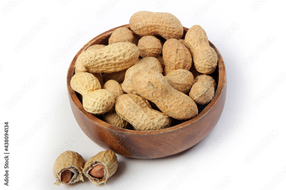 Fresh shelled peanuts in bamboo plate Fresh shelled peanuts in bamboo plate