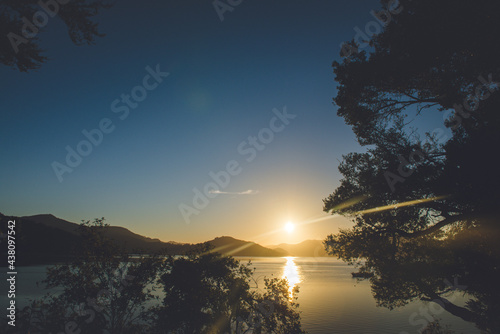 The Morning Sun in Kenepuru Sound, Marlborough Sounds, New Zealand photo