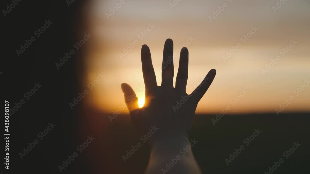 Hand Rises From Sun For Help Reaching out to the sun, happy girl at sunset, sunlight shining on her ...
