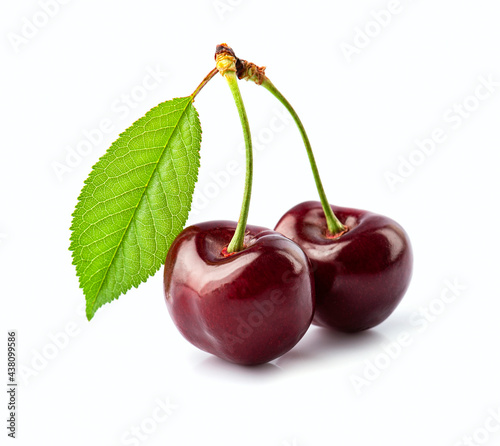 Two sweet cherry with leaves