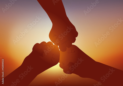 Concept de la solidarité et de l’amitié, avec trois poings unis qui symbolisent la fraternité et le partenariat. photo