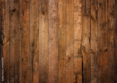 Old dark barn wood background texture. Vintage weathered rough planks backdrop.