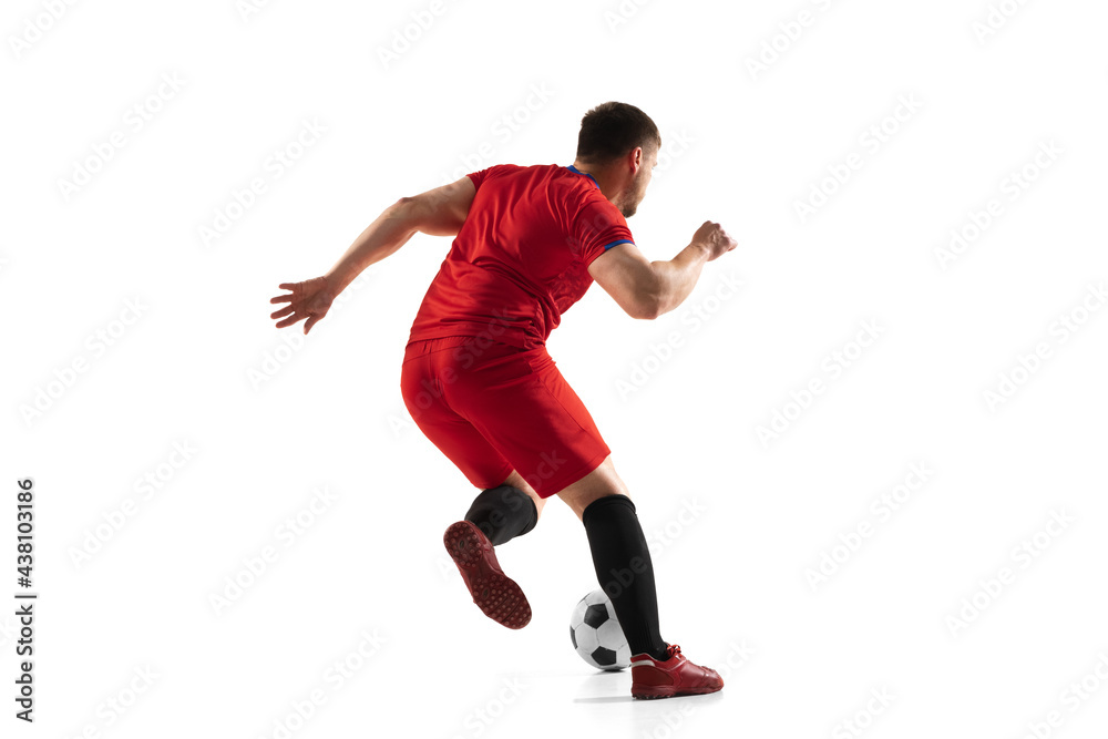 Powerful, flying above the field. Young football, soccer player in action, motion isolated on white background .