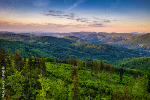 Panorama of the Silesian Beskids from Rownica peak at sunrise. Poland