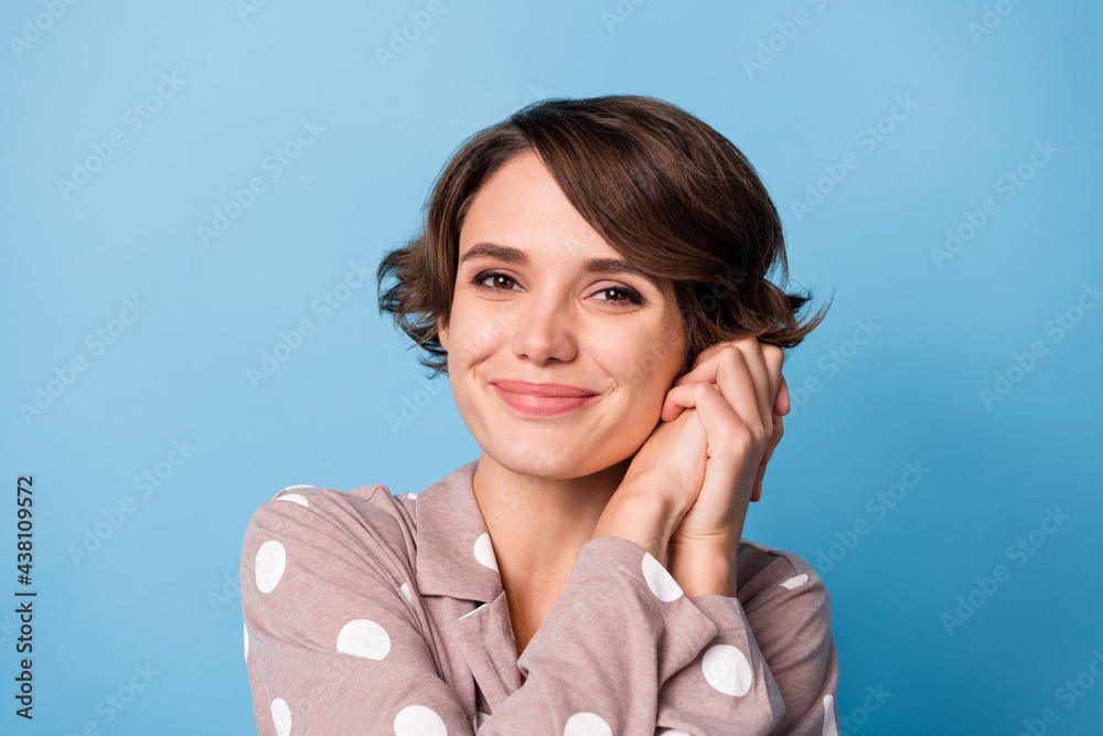 Photo of young attractive girl happy positive smile dream dreamy enjoy isolated over blue color background Photo of young attractive girl happy positive smile dream dreamy enjoy isolated over blue color background