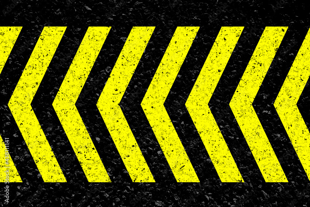 Fototapeta premium Chevrons jaunes sur asphalte 