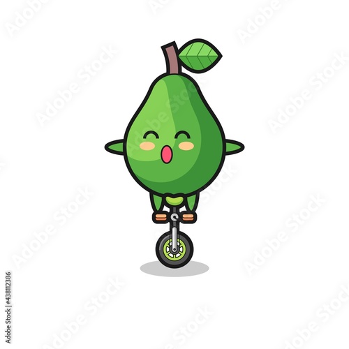 The cute avocado character is riding a circus bike