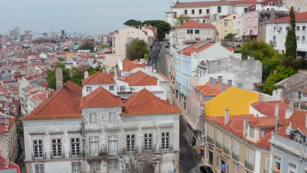 Aerial view of steep hills full of residential colorful houses and narrow streets in urban city center of Lisbon, Portugal Aerial view of steep hills full of residential colorful houses and narrow streets in urban city center of Lisbon, Portugal