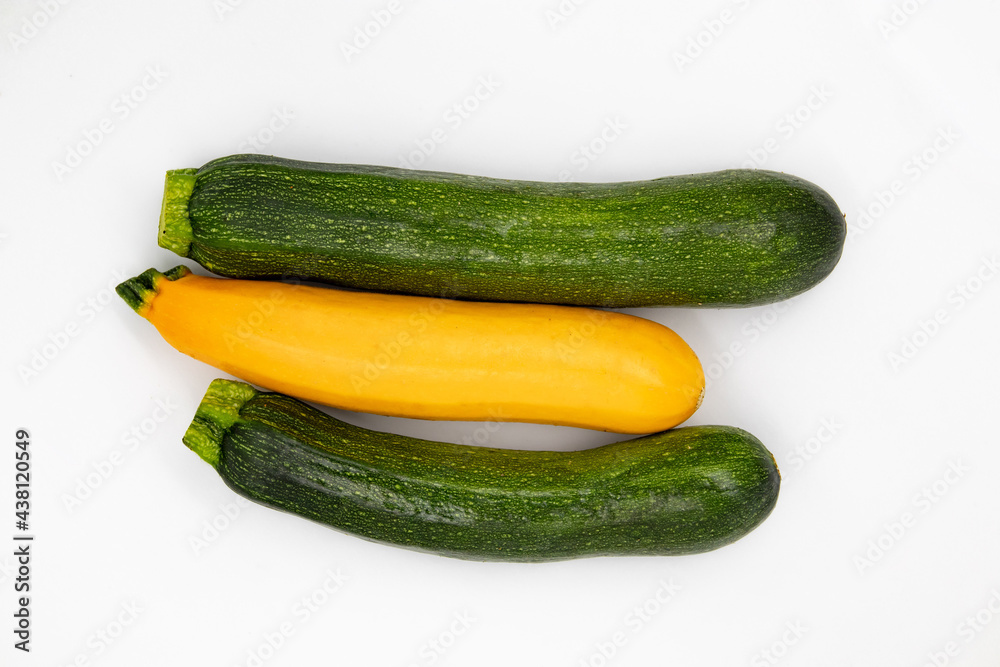 Courgette Isolated on White Background. Fresh Organic Vegetarian Zucchini Plant. Marrow Squash Raw Agriculture Food. Yellow and Green Ugly Organic Veggies Closeup. Delicious Garden Greenery Courgette Isolated on White Background. Fresh Organic Vegetarian Zucchini Plant. Marrow Squash Raw Agriculture Food. Yellow and Green Ugly Organic Veggies Closeup. Delicious Garden Greenery