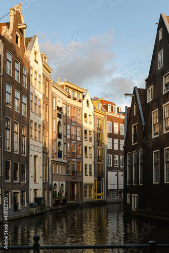 Historical buildings of Amsterdam in the sunset light.
