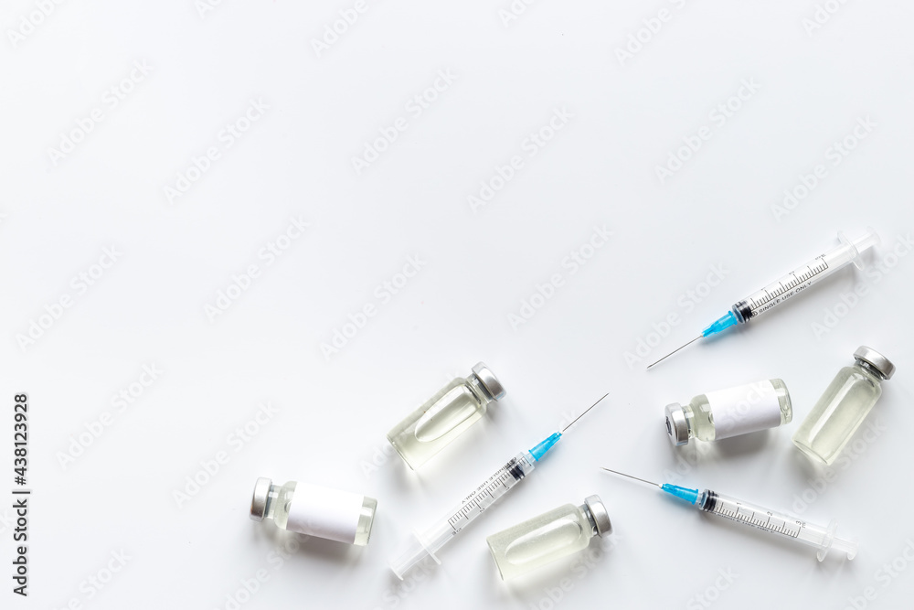 Vaccination with Covid vaccine in bottles with syringe Vaccination with Covid vaccine in bottles with syringe