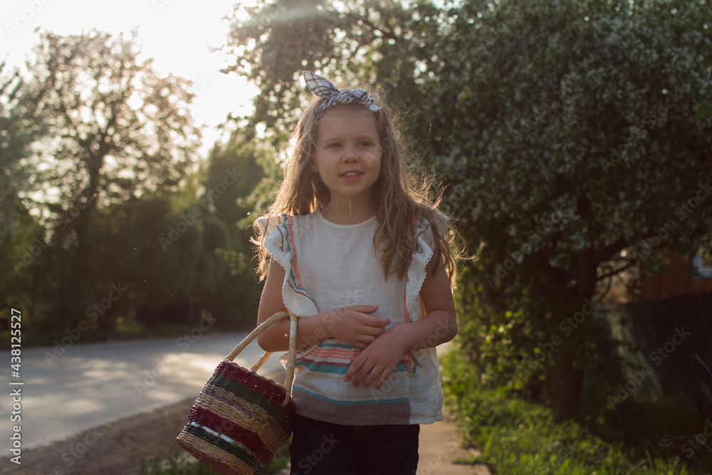 girl with basket walking in countryside on sunlight, russian village colour girl with basket walking in countryside on sunlight, russian village colour
