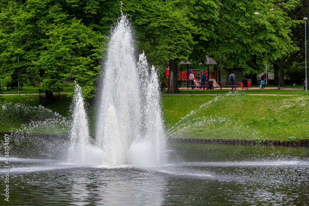 fountain in the city park on a sunny spring day, Riga, Latvia, free space for text