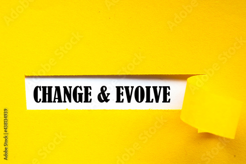 Canvas Print CHANGE EVOLVE. text on white paper over torn paper background.