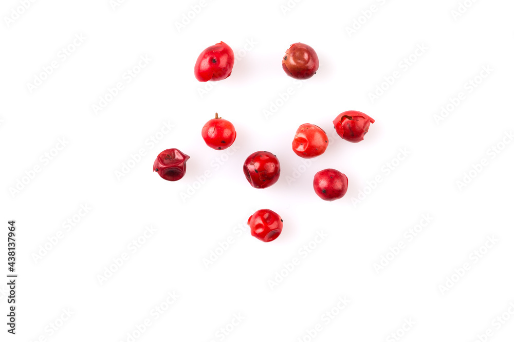 red peppercorns on white red peppercorns on white