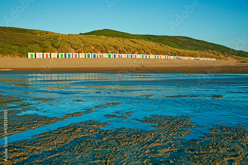 Rows of beach huts along Woolacombe Beach, voted amongst the world's beat photo