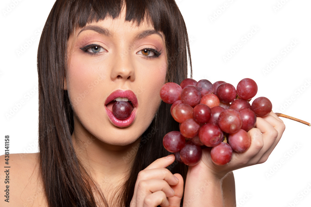Portrait of young woman posing with grapes Portrait of young woman posing with grapes