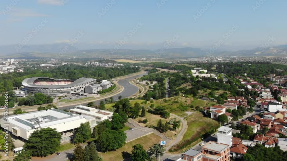Panoramic drone view of the multisport stadium in Skopje, the capital of North Macedonia. Skopje City Stadium. Drone view of the longest river Vardar in North Macedonia. Panoramic drone view of the multisport stadium in Skopje, the capital of North Macedonia. Skopje City Stadium. Drone view of the longest river Vardar in North Macedonia.