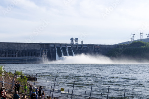 Discharge of excess water from floodgates during flooding. Discharge of excess water at hydroelectric power plants