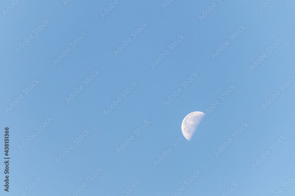 the moon in a clear blue sky the moon in a clear blue sky