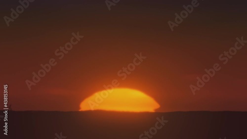 African sunset time lapse with big sun and cloudless sky Cinematic 4k footage.