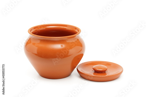 open clay pot for cooking on white