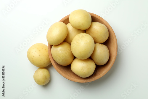 Bowl of young potato on white background