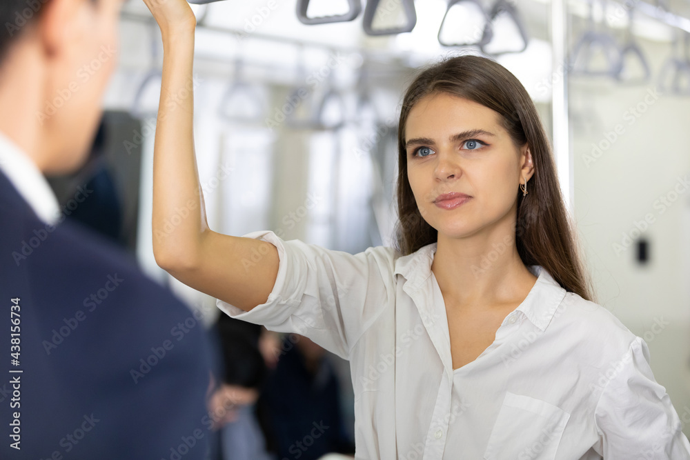 beautiful woman feeling angry to someone in the subway train beautiful woman feeling angry to someone in the subway train
