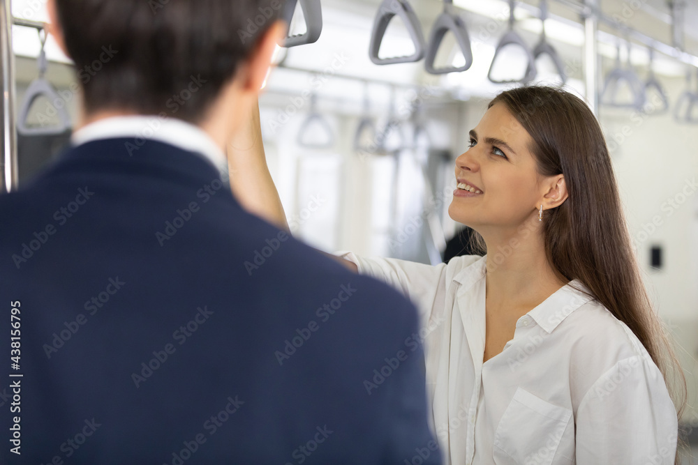 beautiful woman talking with friends in the subway train beautiful woman talking with friends in the subway train