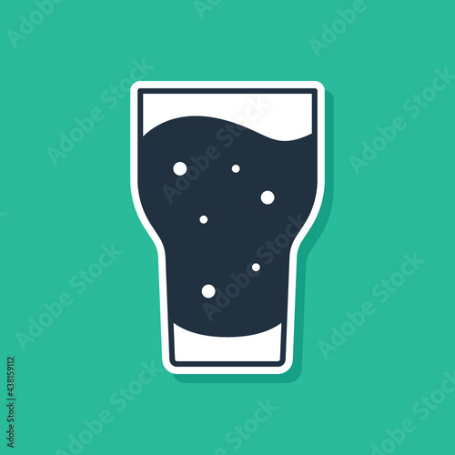 Blue Glass of beer icon isolated on green background. Vector