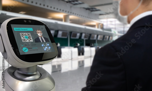 Smart hospitality industry concept, airport or hotel using robot to  scan and personal data check with customer who got covid-19 vaccinate by using face recognition detection technology