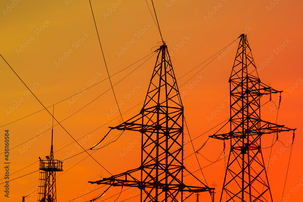 Electricity towers silhouettes at dusk