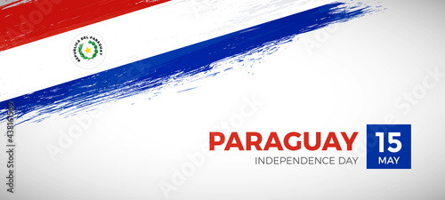 Happy independence day of Paraguay with brush painted grunge flag background
