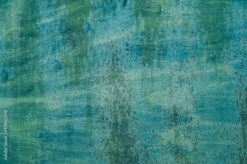 Aged blue green weathered background with scratches and spots or grunge rough surface metal backdrop.