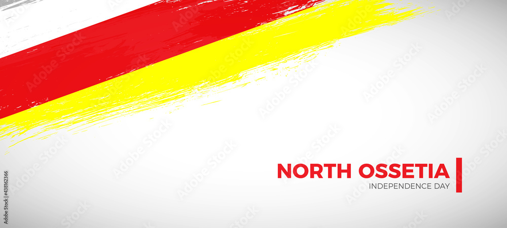 Obraz premium Happy independence day of North Ossetia with brush painted grunge flag background