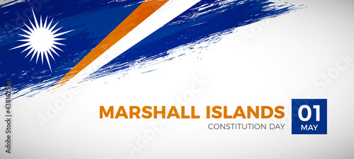 Happy constitution day of Marshall Islands with brush painted grunge flag background