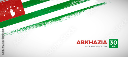 Happy independence day of Abkhazia with brush painted grunge flag background