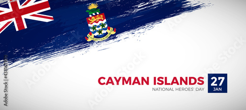 Happy national heroes day of Cayman Islands with brush painted grunge flag background photo