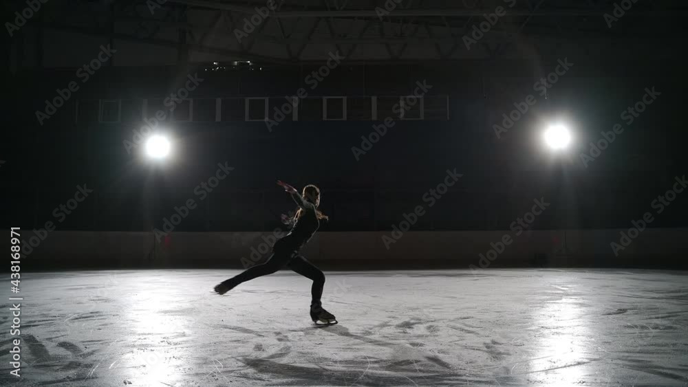 Skater training at the indoor ice rink. Figure skating at the stadium