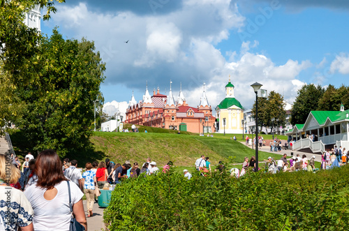 Pilgrims and tourists in a dense stream go to worship the shrines in the monastery of St. Sergius Lavra to St. Sergius of Radonezh. Sergiev Posad, Russia. photo