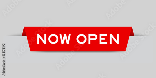 Red color inserted label with word now open on gray background