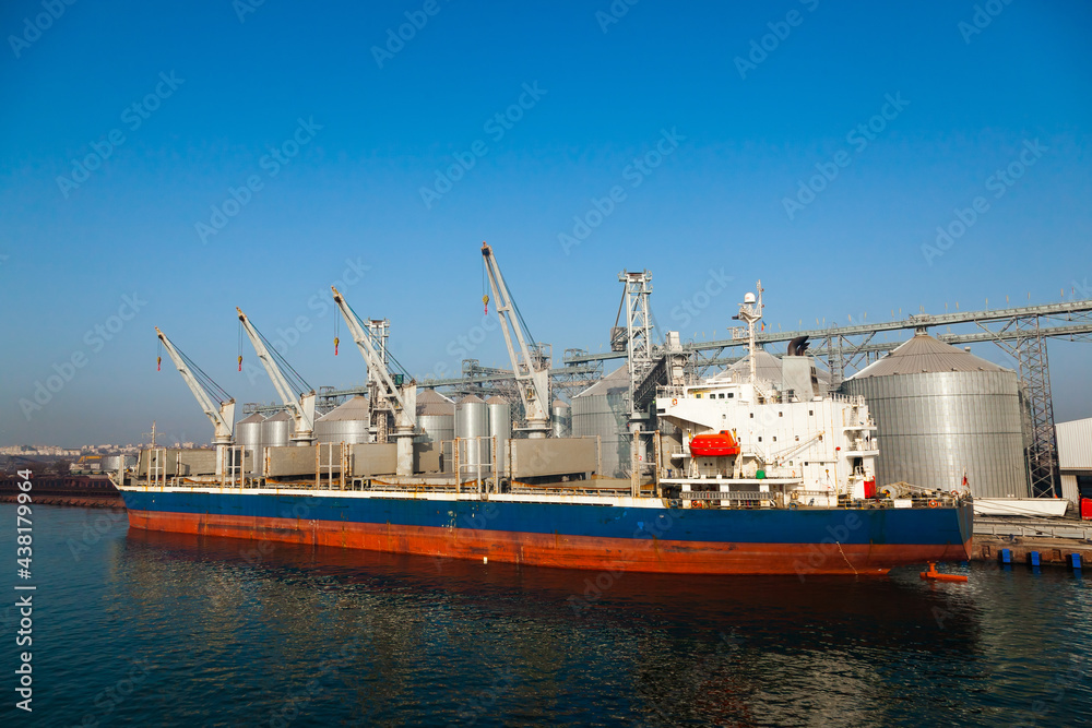 A cargo transport ship is moored at the pier in the port of Constanta Romania.