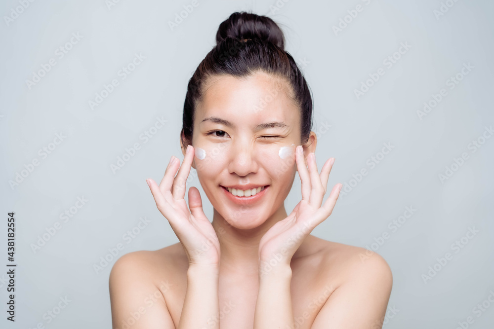 Beautiful young asian woman with clean fresh skin on white background. Asian women portrait. Beautiful young asian woman with clean fresh skin on white background. Asian women portrait.