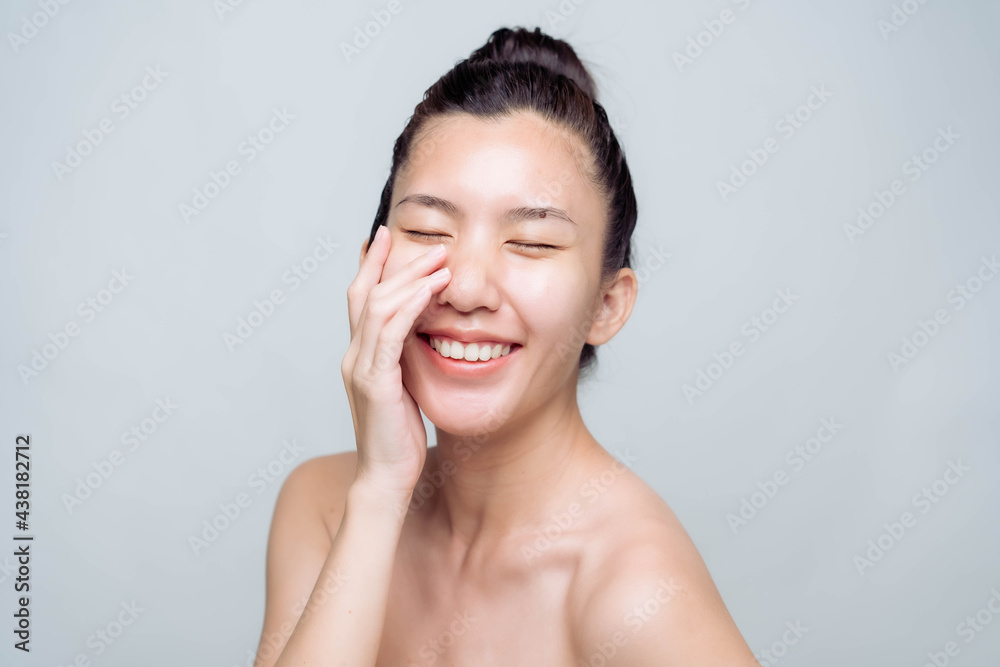 Beautiful young asian woman with clean fresh skin on white background. Asian women portrait. Beautiful young asian woman with clean fresh skin on white background. Asian women portrait.