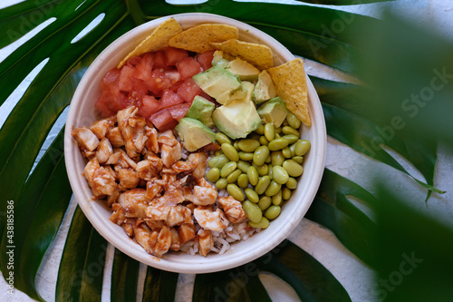 Delicious poke bowl with chicken and veggies photo