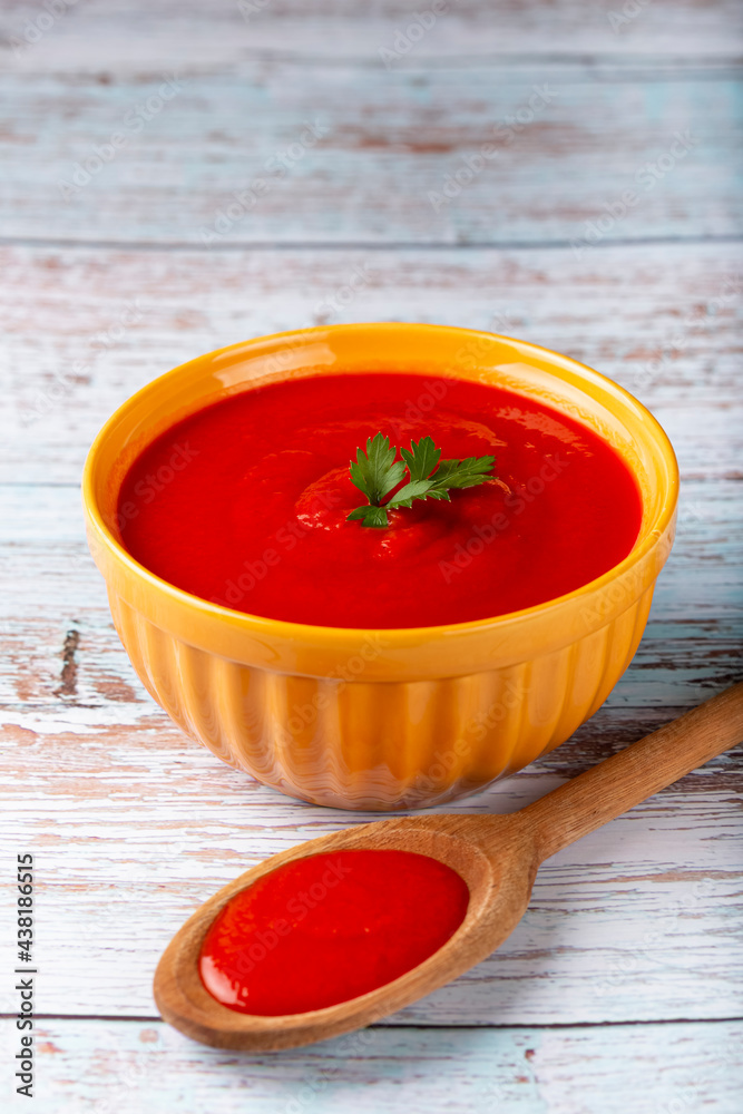 Delicious homemade tomato soup in bowl.