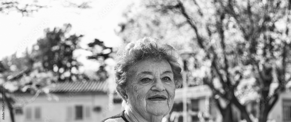 Elderly woman in hospital garden