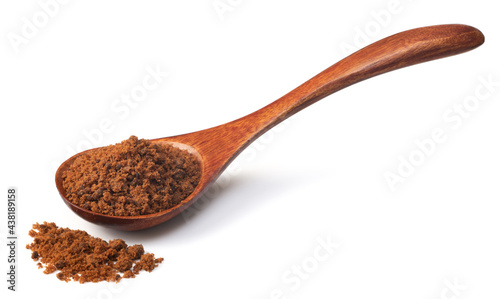 brown sugar in the wooden spoon, isolated on white background