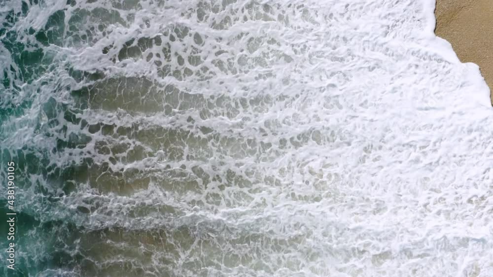 4K Aerial drone top down view bird eye view of sea blue waves break on rock and sand. Beautiful of sea water wave come to beach. Phuket Thailand tropical beach 4K Aerial drone top down view bird eye view of sea blue waves break on rock and sand. Beautiful of sea water wave come to beach. Phuket Thailand tropical beach