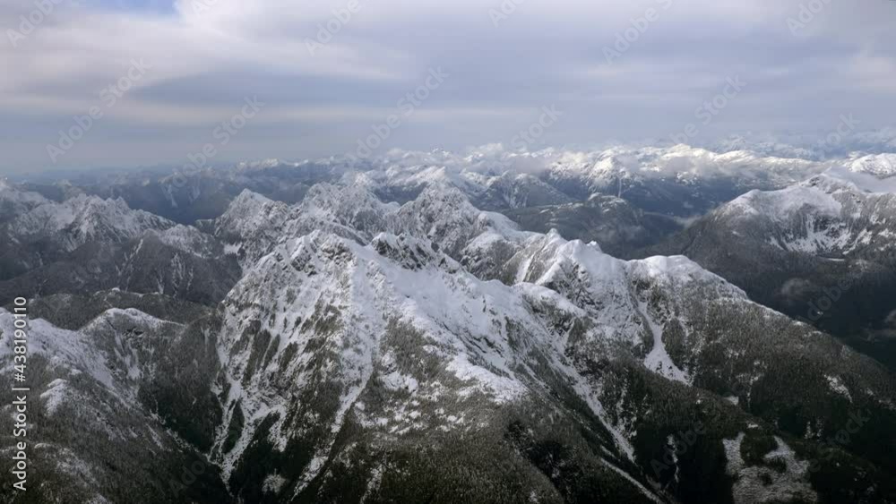 Beautiful landscape with snow covered mountain top. Aerial circling Beautiful landscape with snow covered mountain top. Aerial circling